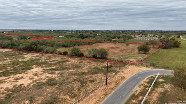 a view of a lake with a yard