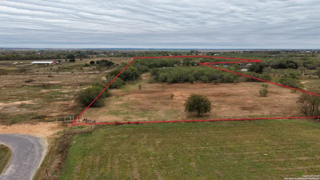 an aerial view of residential building and ocean