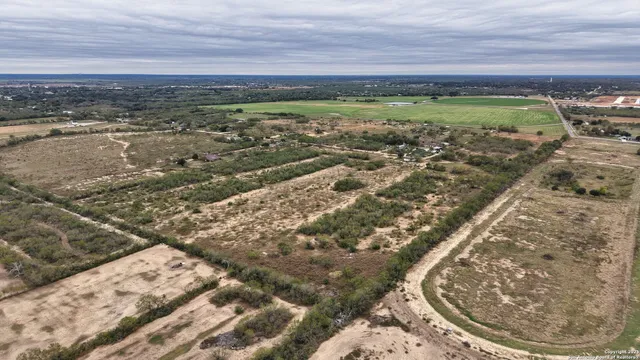 an aerial view of residential building and ocean