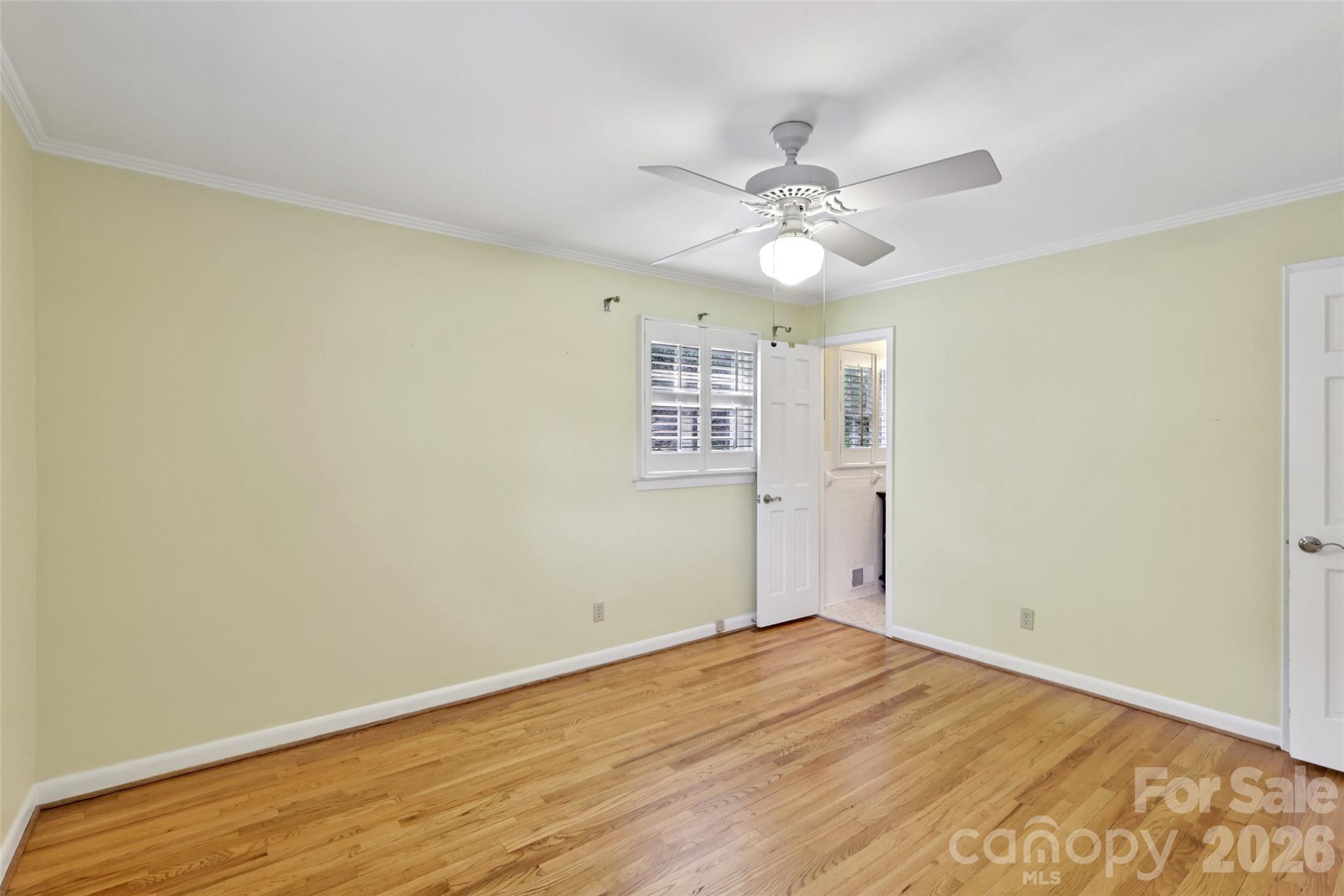 1002 Ridge Street Albemarle, NC 28001 - Photo 23 of 45 a view of an empty room with wooden floor and a fan