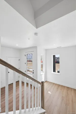 a view of a hallway with windows