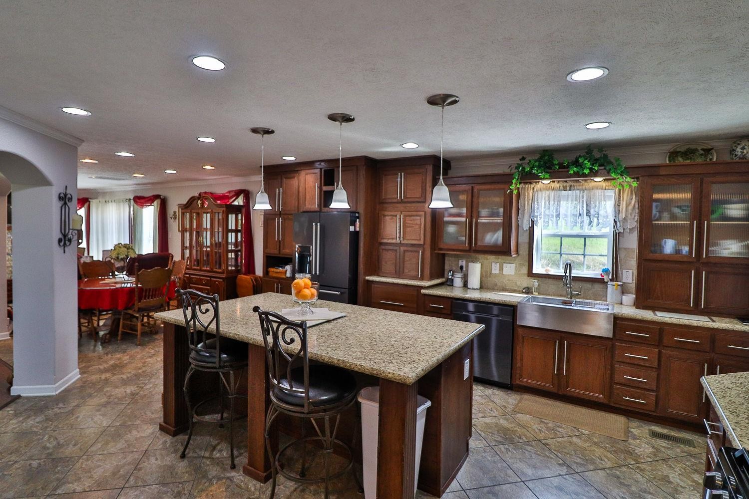 492 Cook Road Portland, TN 37148 - Photo 1 of 28 a kitchen with a table and chairs in it