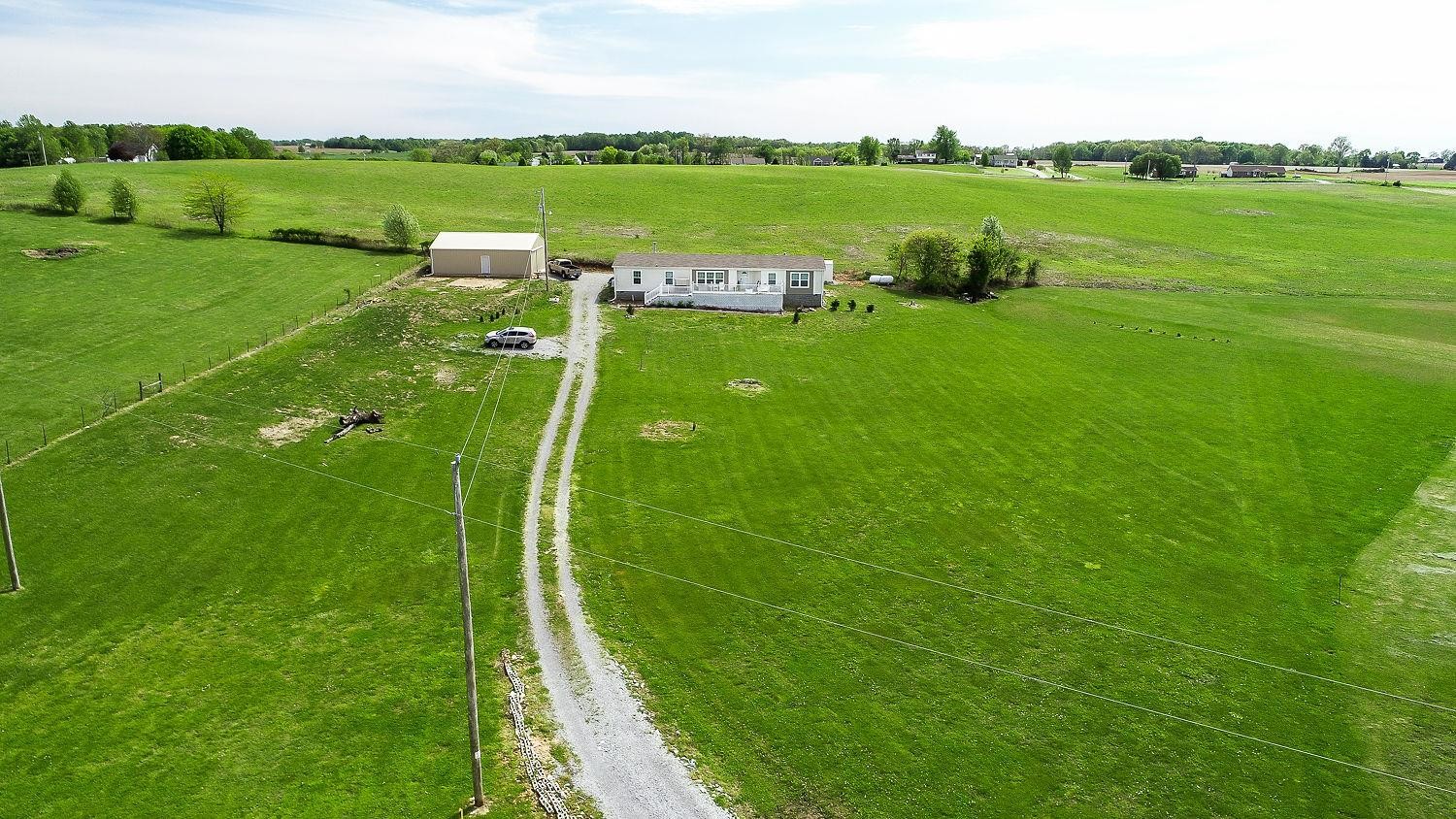 492 Cook Road Portland, TN 37148 - Photo 26 of 28 a view of a golf course with a lake