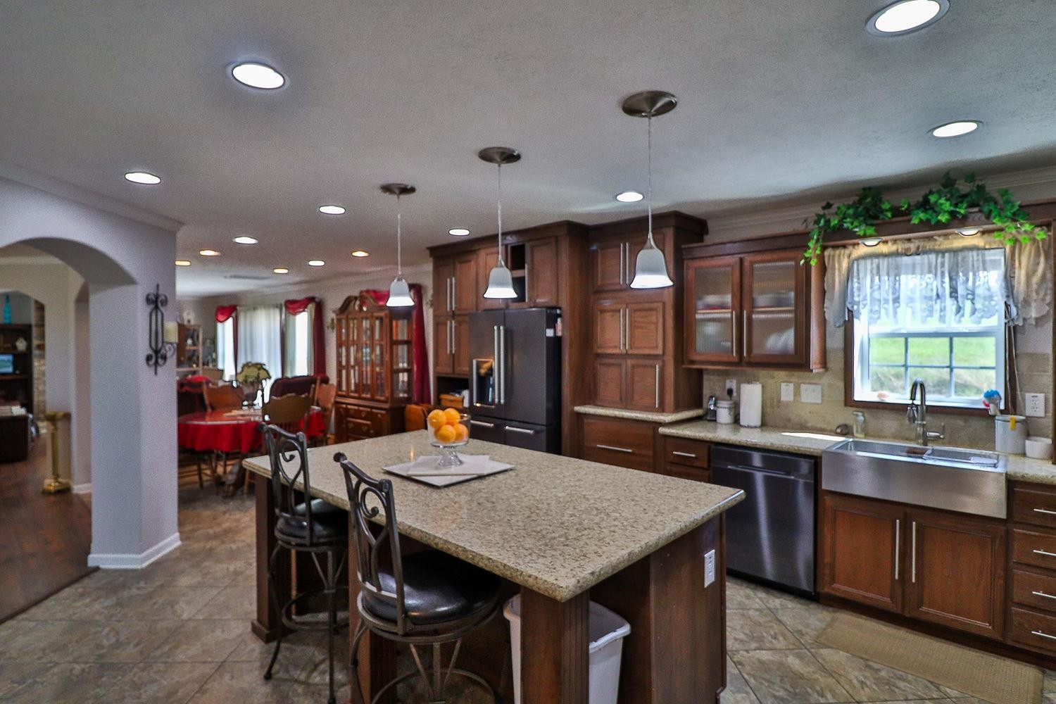 492 Cook Road Portland, TN 37148 - Photo 4 of 28 a kitchen with a table and chairs in it