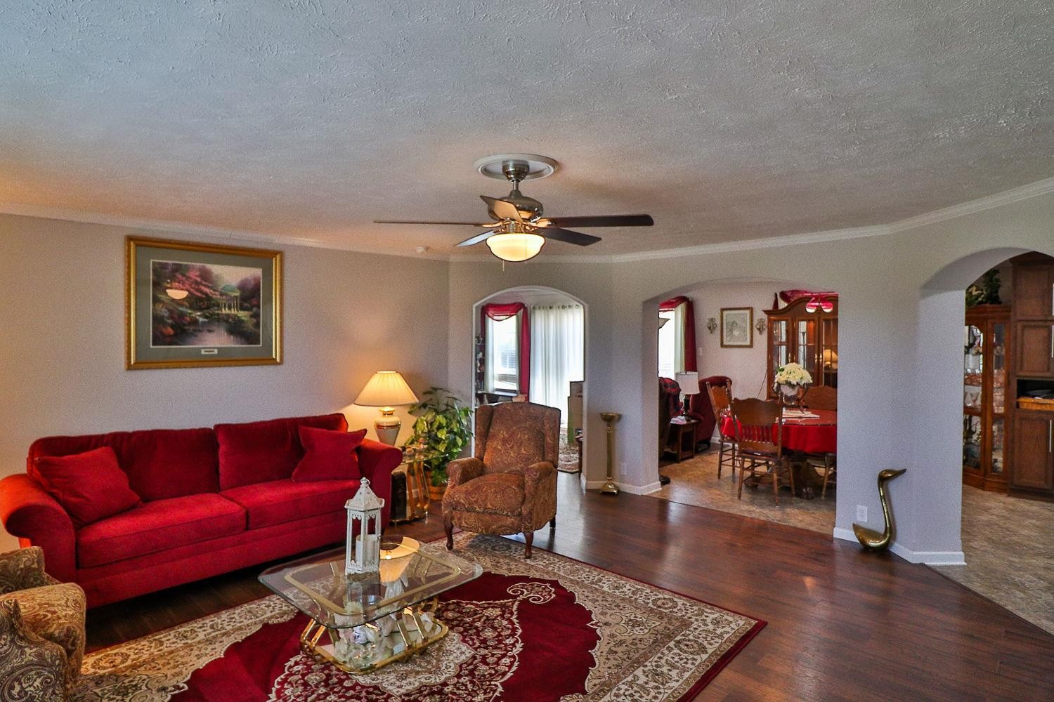 492 Cook Road Portland, TN 37148 - Photo 6 of 28 a living room with furniture a chandelier and a rug