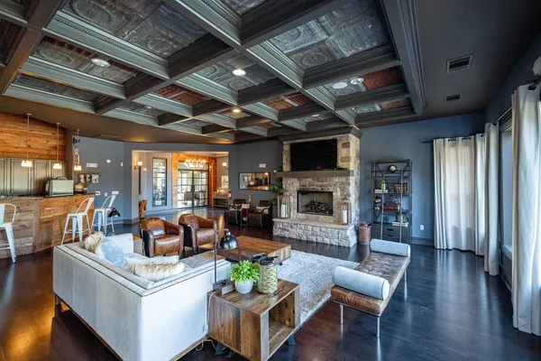 a living room with fireplace furniture and a flat screen tv