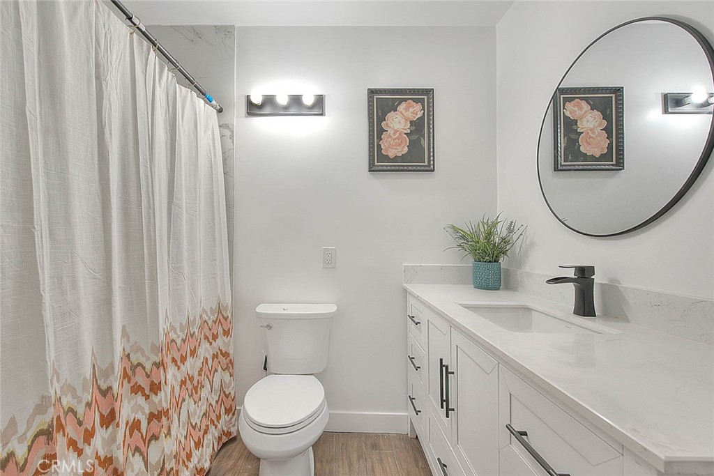 2112 California Duarte, CA 91010 - Photo 30 of 71 a bathroom with a toilet a sink and a mirror
