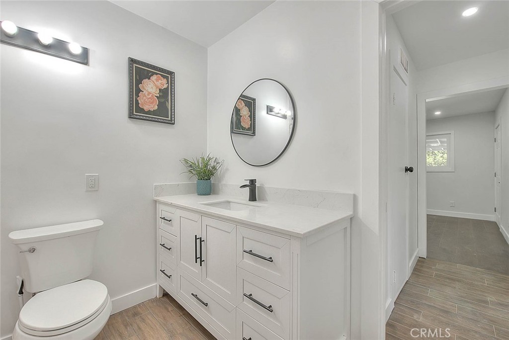 2112 California Duarte, CA 91010 - Photo 31 of 71 a bathroom with a toilet a sink and a mirror