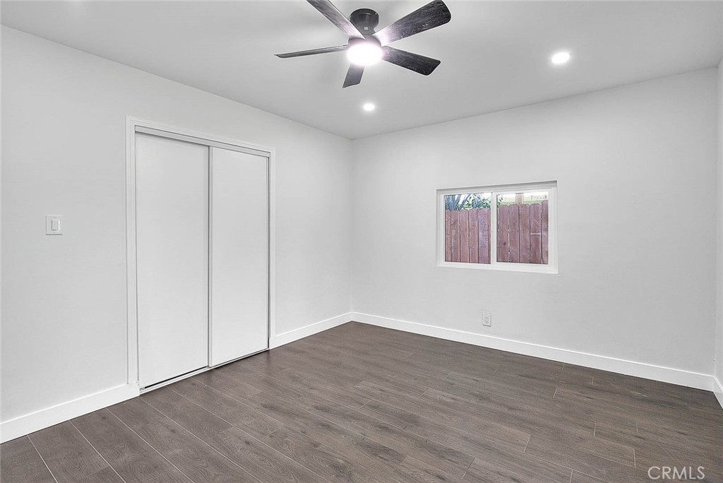 2112 California Duarte, CA 91010 - Photo 39 of 71 an empty room with wooden floor ceiling fan and windows