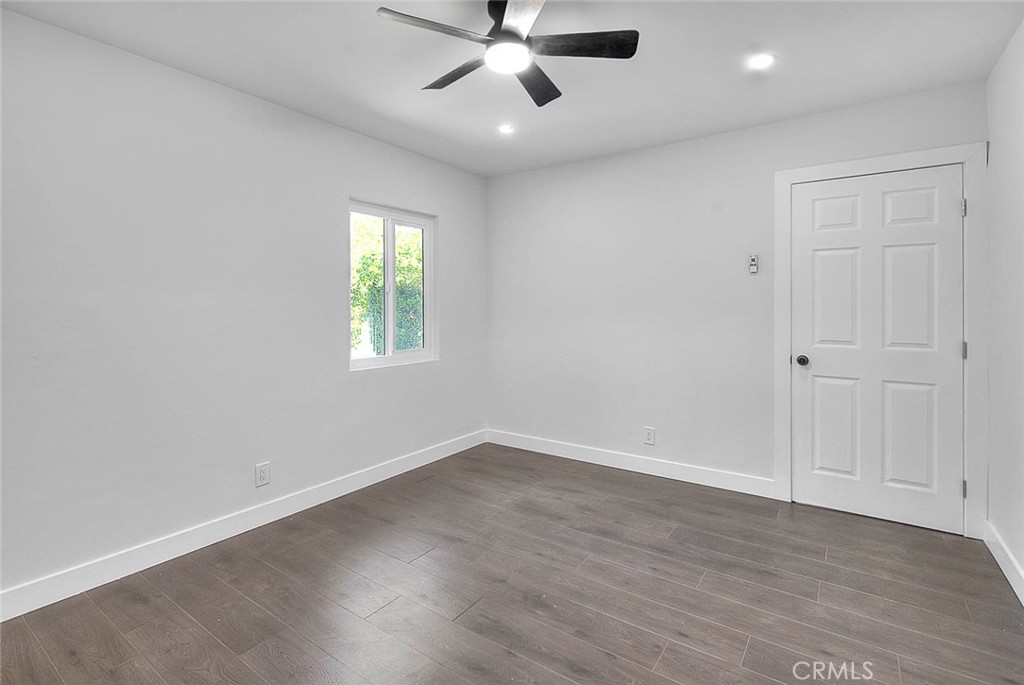 2112 California Duarte, CA 91010 - Photo 40 of 71 an empty room with wooden floor ceiling fan and windows