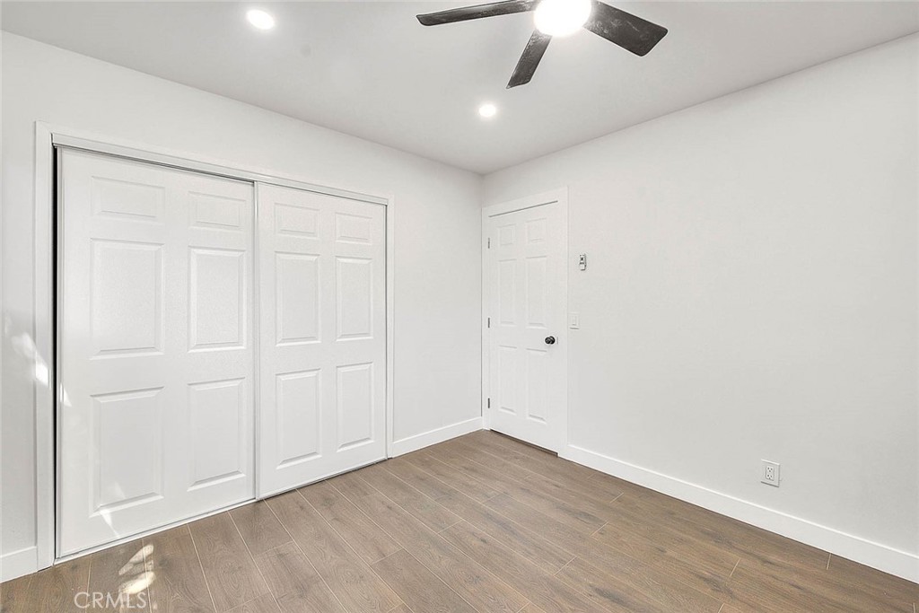 2112 California Duarte, CA 91010 - Photo 48 of 71 an empty room with a ceiling fan and wooden floor