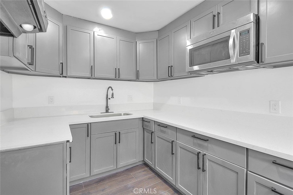 2112 California Duarte, CA 91010 - Photo 58 of 71 a kitchen with a sink cabinets and stainless steel appliances