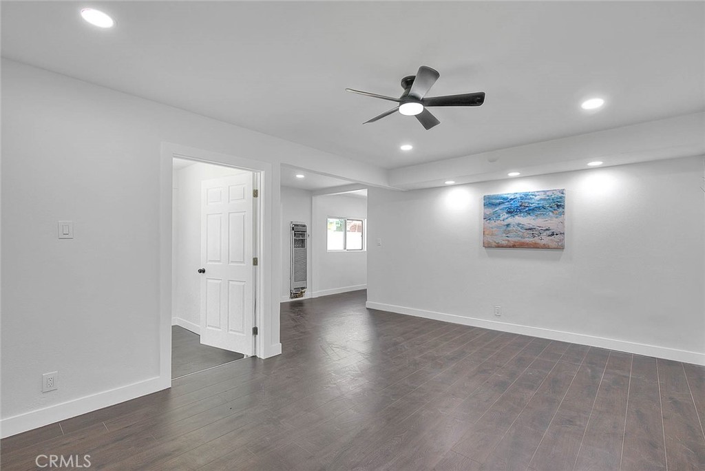 2112 California Duarte, CA 91010 - Photo 66 of 71 an empty room with wooden floor ceiling fan and windows
