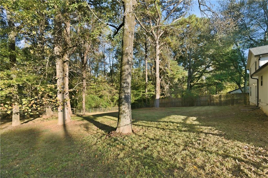 4974 Browns Mill Road Lithonia, GA 30038 - Photo 18 of 18 a view of a lake with a yard