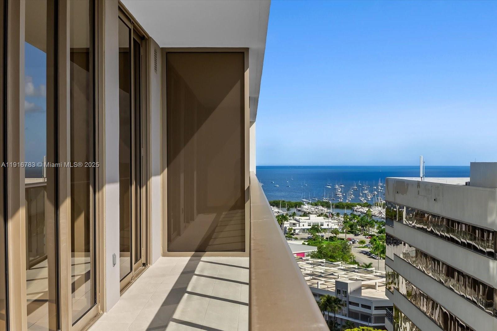 2678 Tigertail Avenue, Unit 1605 Miami, FL 33133 - Photo 2 of 17 a view of a balcony with an ocean