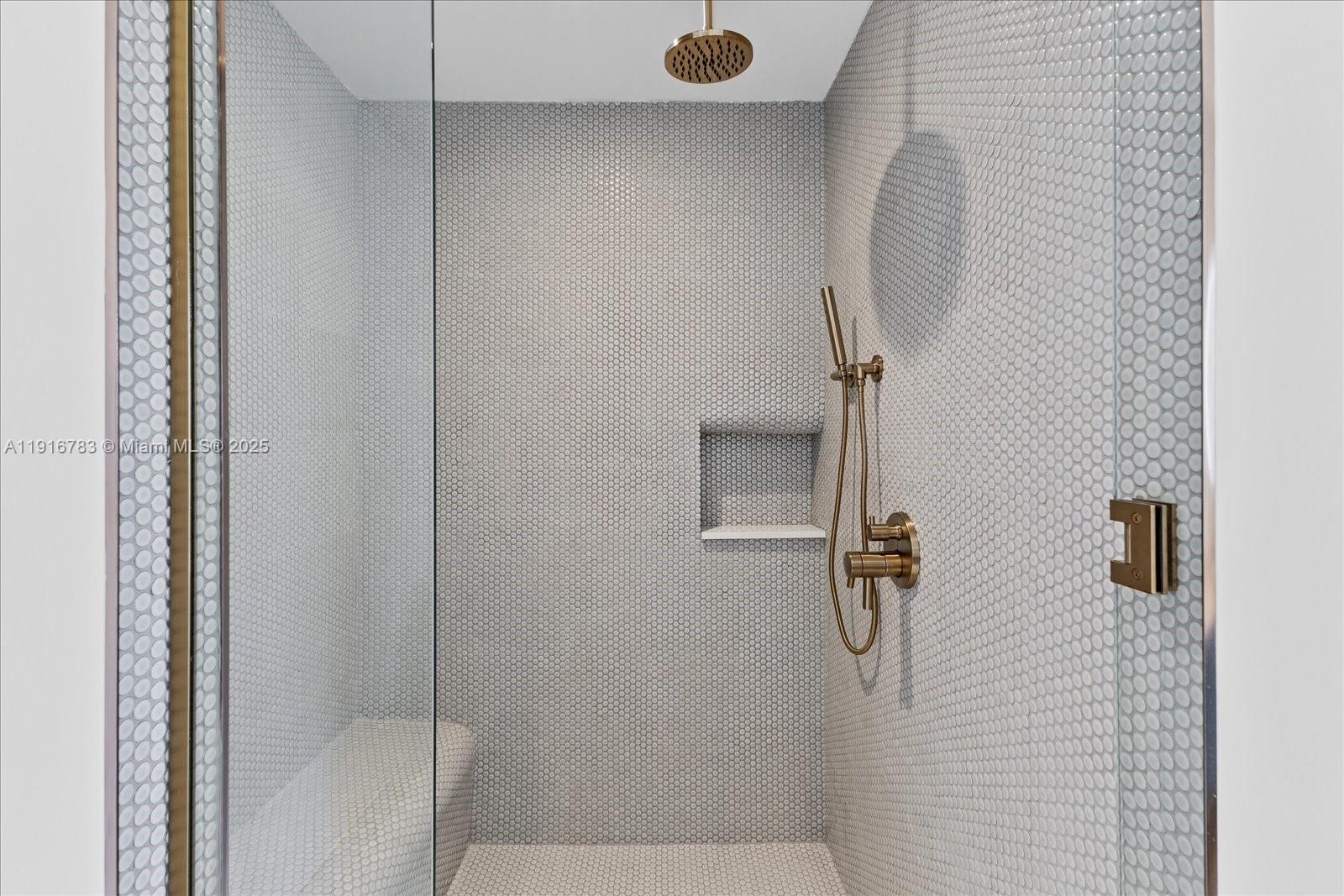 2678 Tigertail Avenue, Unit 1605 Miami, FL 33133 - Photo 10 of 17 a bathroom with a shower