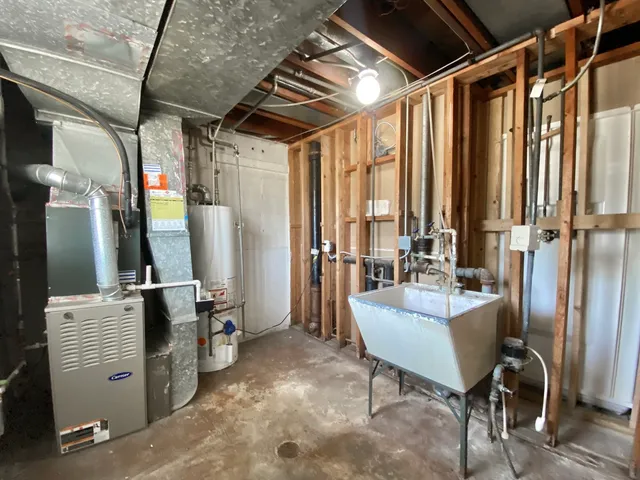a room with table chairs and flat screen tv