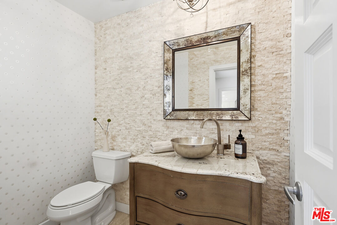 10 Baymare Road Bell Canyon, CA 91307 - Photo 12 of 54 a bathroom with a toilet a sink and mirror