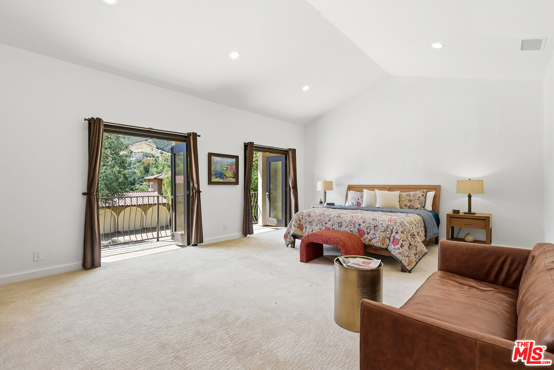 10 Baymare Road Bell Canyon, CA 91307 - Photo 23 of 54 a spacious bedroom with a bed and glass window