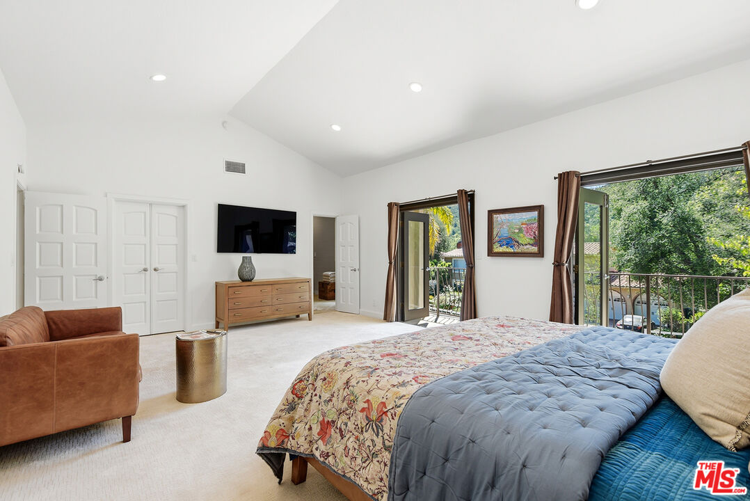 10 Baymare Road Bell Canyon, CA 91307 - Photo 24 of 54 a spacious bedroom with a large bed and a flat screen tv
