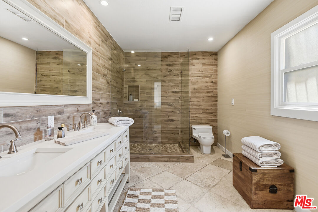 10 Baymare Road Bell Canyon, CA 91307 - Photo 26 of 54 a bathroom with a double vanity sink toilet and shower