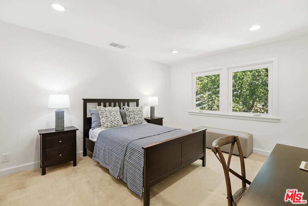 10 Baymare Road Bell Canyon, CA 91307 - Photo 27 of 54 a bedroom with a bed and a table