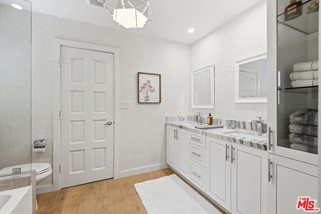 10 Baymare Road Bell Canyon, CA 91307 - Photo 29 of 54 a spacious bathroom with a granite countertop sink a toilet mirror and a bathtub