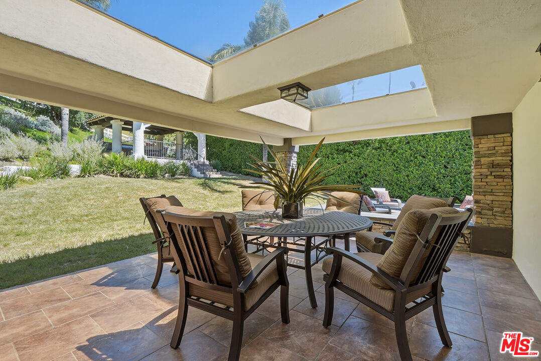 10 Baymare Road Bell Canyon, CA 91307 - Photo 37 of 54 a view of a patio with a table and chairs