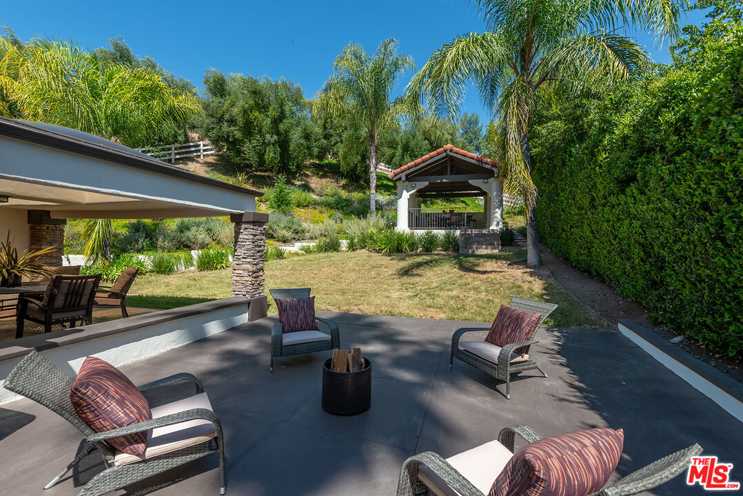 10 Baymare Road Bell Canyon, CA 91307 - Photo 39 of 54 a view of backyard with seating space and trees in the background