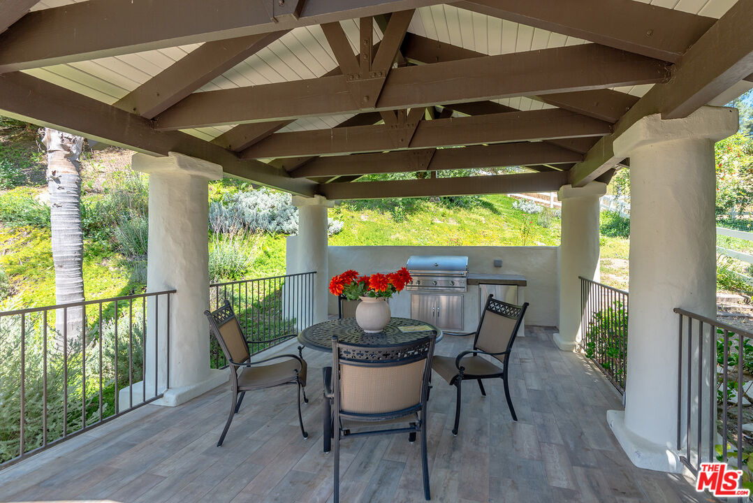 10 Baymare Road Bell Canyon, CA 91307 - Photo 40 of 54 a dining room with furniture and garden view