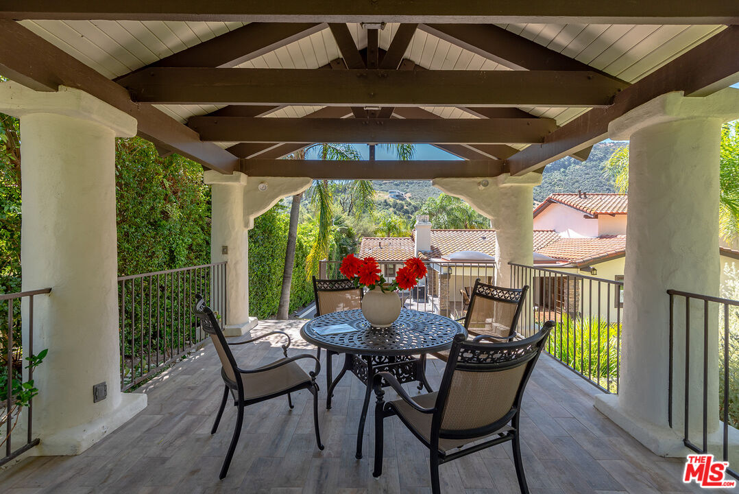 10 Baymare Road Bell Canyon, CA 91307 - Photo 42 of 54 a view of a patio with a table chairs and a umbrella
