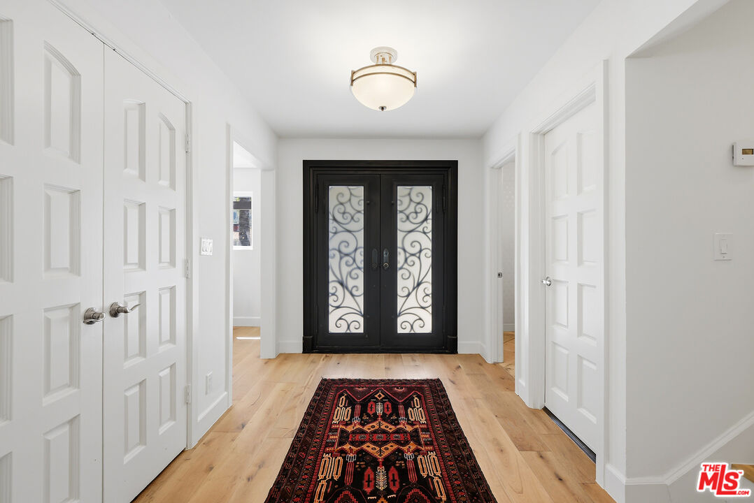 10 Baymare Road Bell Canyon, CA 91307 - Photo 7 of 54 a view of a hallway with wooden floor and a bathroom