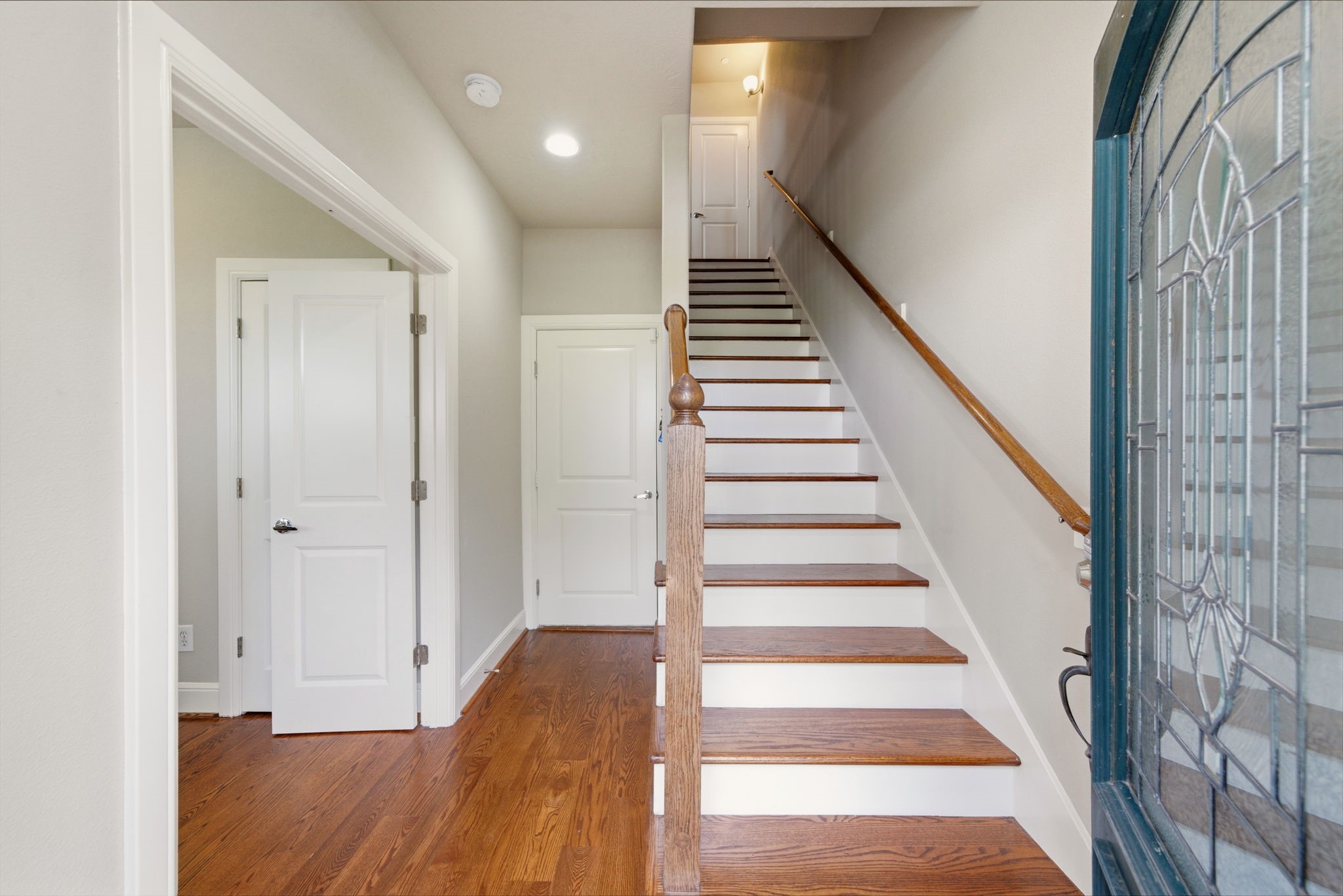 2110 Shearn Street, Unit 16 Houston, TX 77007 - Photo 2 of 37 Front door opens into an entryway. Door ahead leads to 2 car garage. Doors on left leads to 1st floor bedroom - perfect as an office with tons of natural light and WOOD floors!