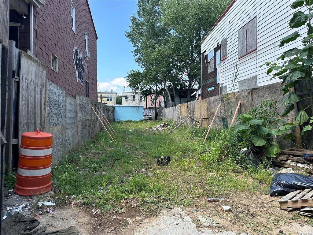 108-35 Roosevelt Avenue Queens, NY 11368 - Photo 1 of 1 a backyard of a house with outdoor seating