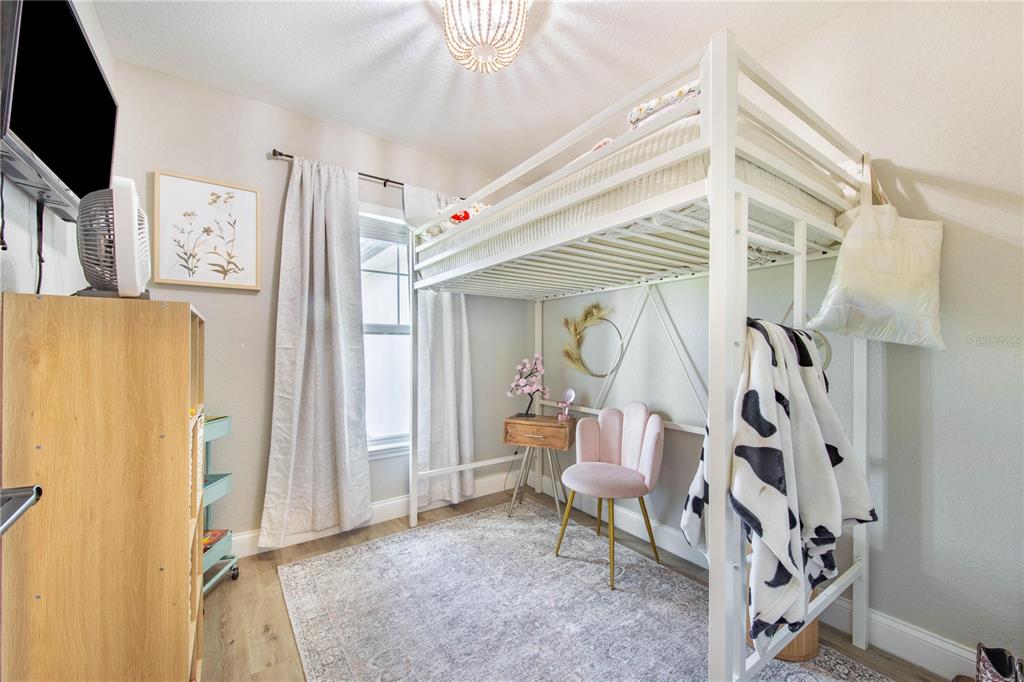 705 Brook Road North Fort Meade, FL 33841 - Photo 15 of 54 a living room with furniture and a flat screen tv