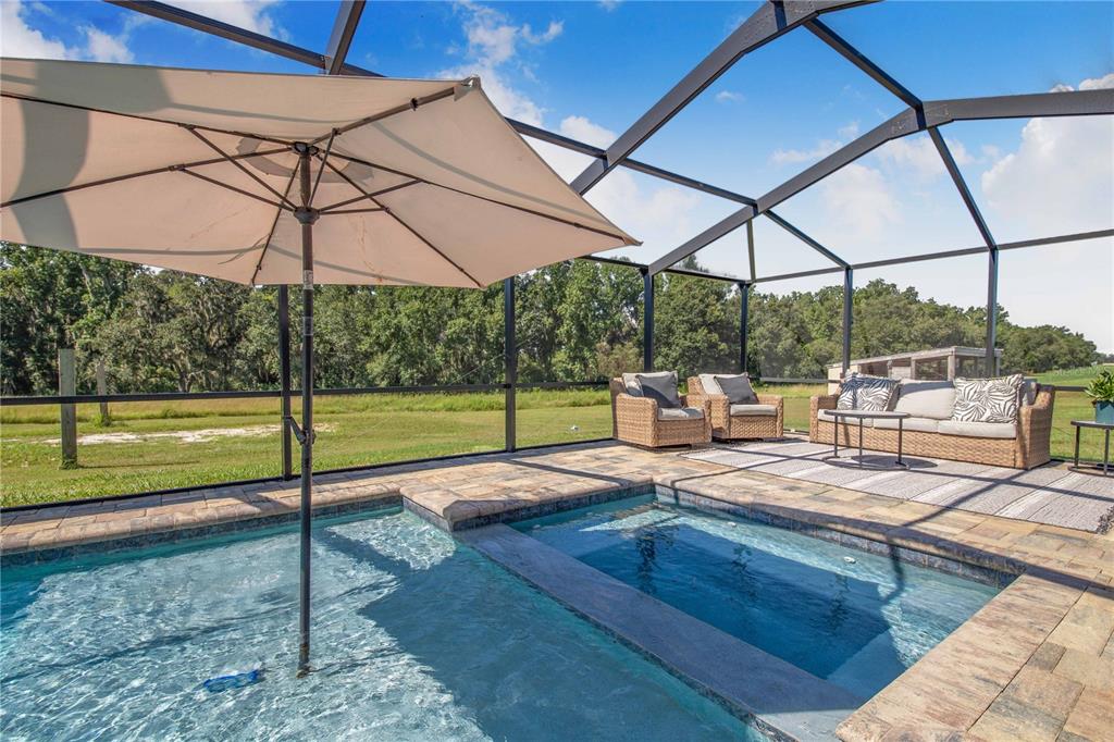 705 Brook Road North Fort Meade, FL 33841 - Photo 22 of 54 a view of a swimming pool with a porch