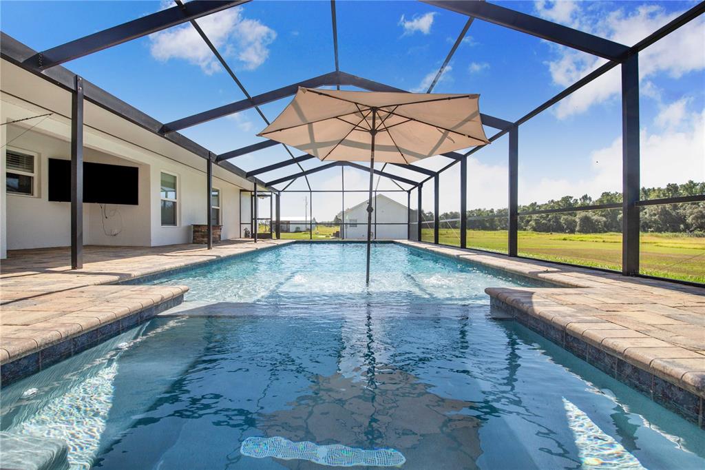 705 Brook Road North Fort Meade, FL 33841 - Photo 26 of 54 a view of a swimming pool with a yard