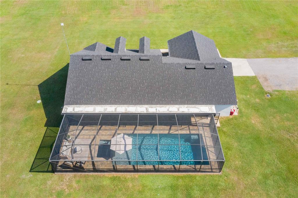 705 Brook Road North Fort Meade, FL 33841 - Photo 28 of 54 an aerial view of a house with swimming pool