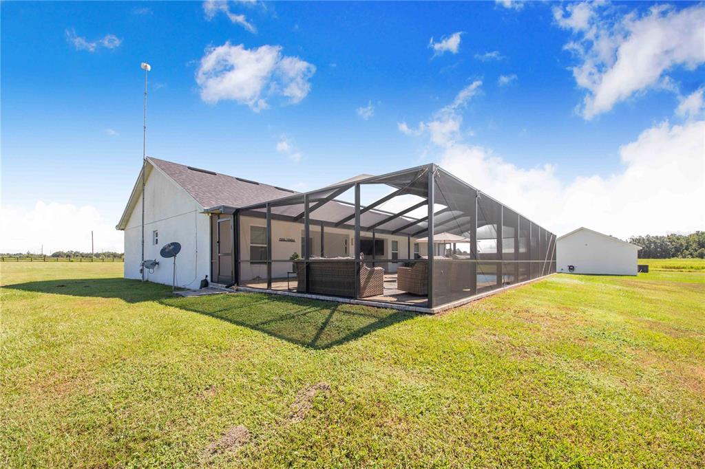 705 Brook Road North Fort Meade, FL 33841 - Photo 31 of 54 a view of a house with a yard and swimming pool