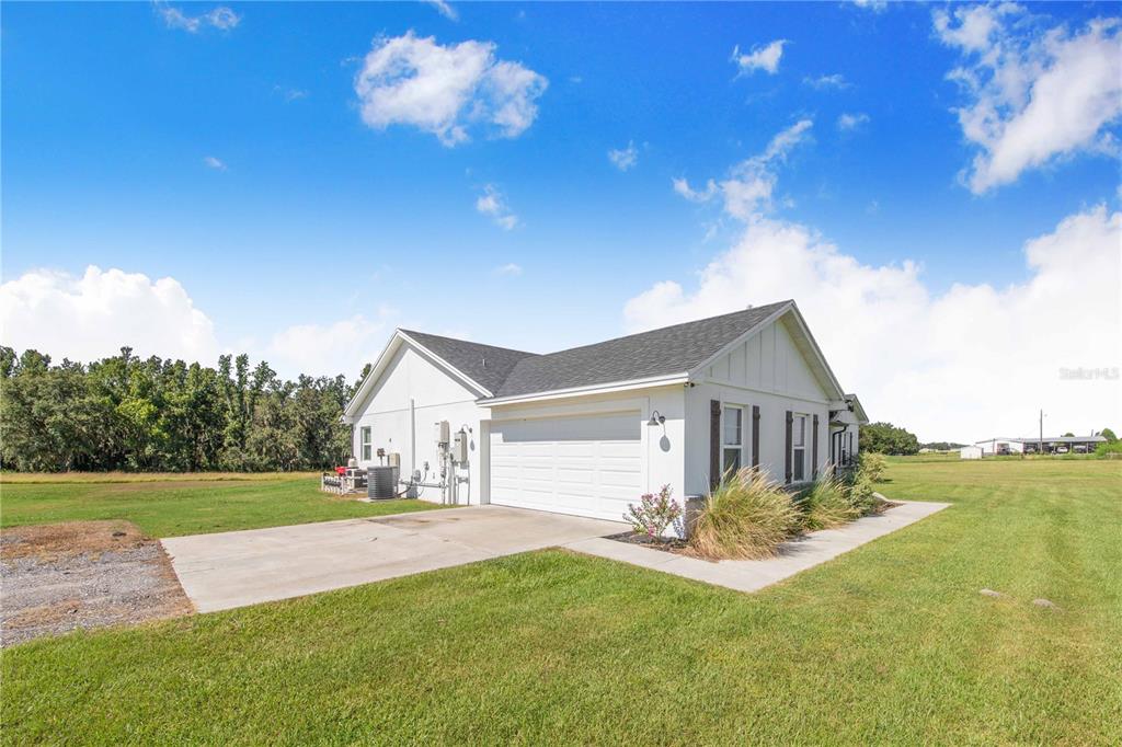 705 Brook Road North Fort Meade, FL 33841 - Photo 34 of 54 a front view of a house with garden