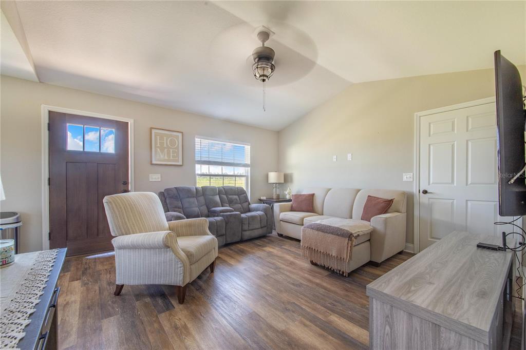 705 Brook Road North Fort Meade, FL 33841 - Photo 36 of 54 a living room with furniture and a couch