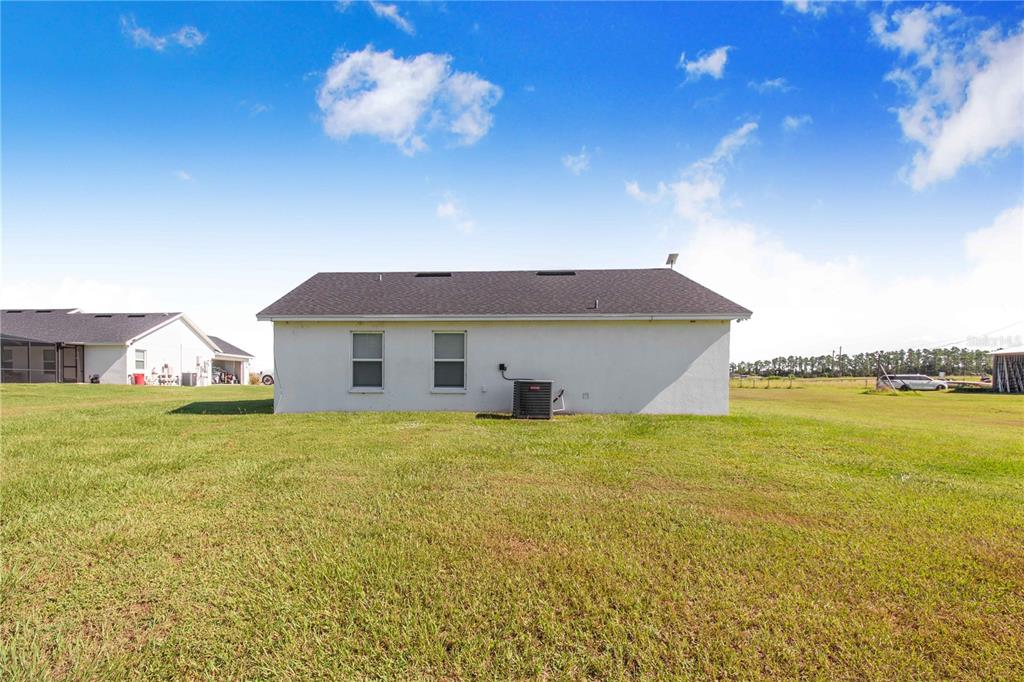 705 Brook Road North Fort Meade, FL 33841 - Photo 44 of 54 a view of a house with a yard