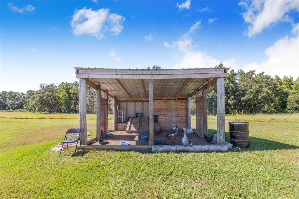 705 Brook Road North Fort Meade, FL 33841 - Photo 47 of 54 a view of a swimming pool with lounge chair