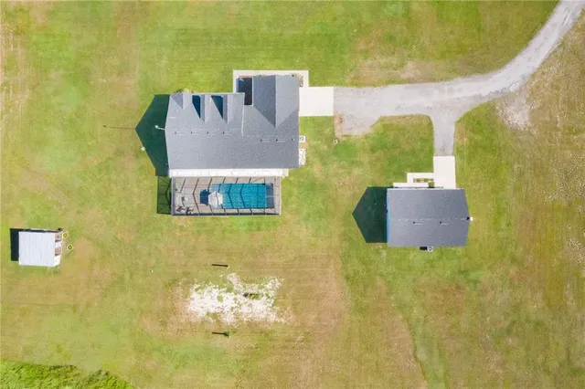 a view of a swimming pool and an outdoor seating