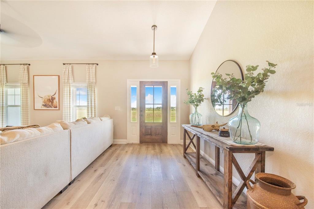 705 Brook Road North Fort Meade, FL 33841 - Photo 5 of 54 a living room with furniture a window and appliances