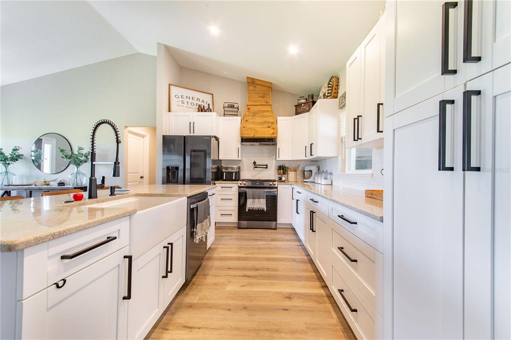 705 Brook Road North Fort Meade, FL 33841 - Photo 9 of 54 a large kitchen with stainless steel appliances lots of counter space and a sink