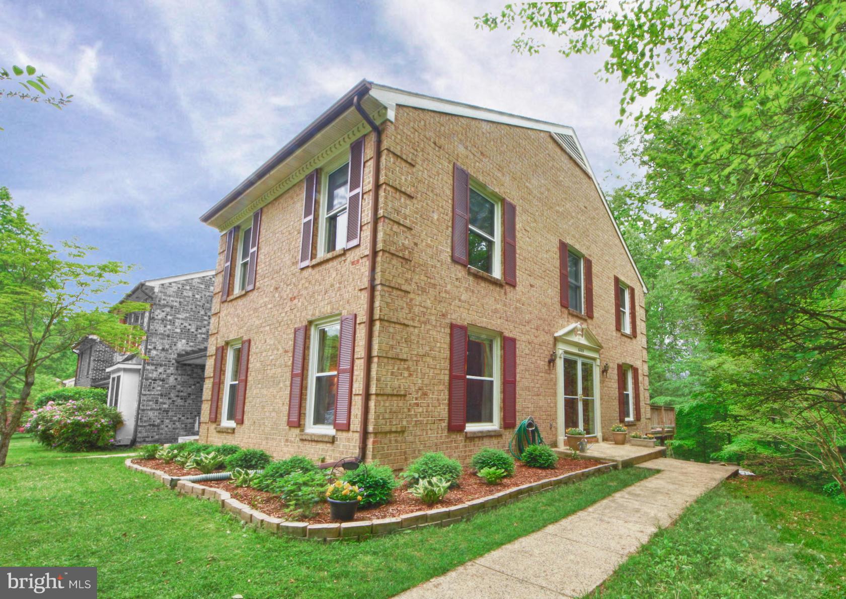 6285 Rathlin Drive Springfield, VA 22152 - Photo 1 of 18 a front view of a house with a yard