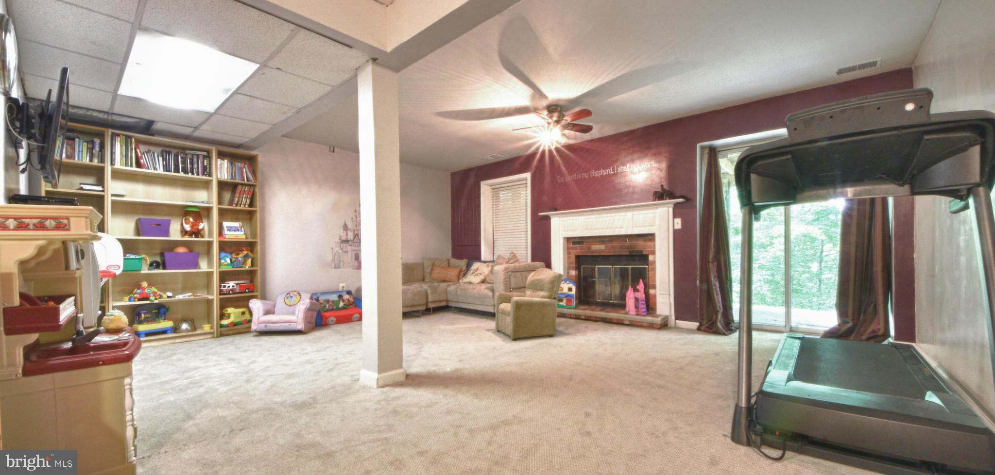 6285 Rathlin Drive Springfield, VA 22152 - Photo 15 of 18 a living room with furniture and a ceiling fan