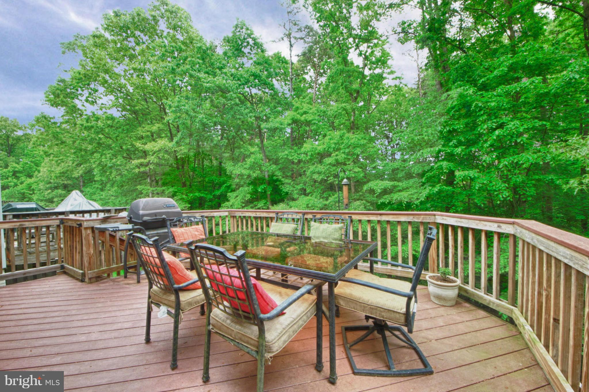 6285 Rathlin Drive Springfield, VA 22152 - Photo 16 of 18 a view of a wooden chairs on the roof deck