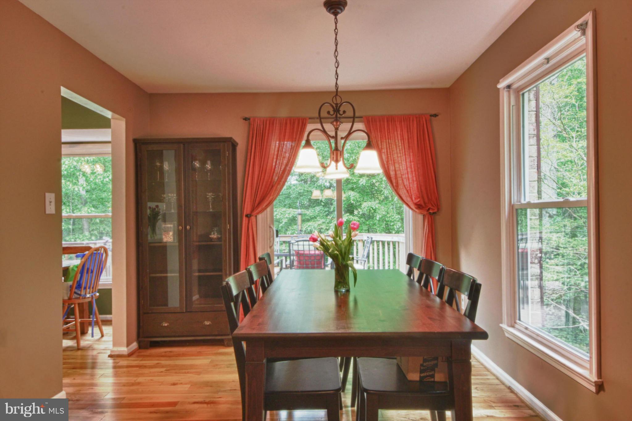 6285 Rathlin Drive Springfield, VA 22152 - Photo 4 of 18 a view of a dining room with furniture window and outside view